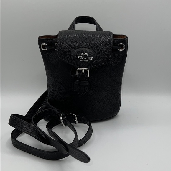 coach amelia backpack Convertible Soft pebble leather Inside zip pocket Snap closure fabric lining Top handle with 1 1/2 drop Adjustable straps convert bag to a crossbody bag from a backpack 6 1/4 (L) x 7 1/2 (H) x 3 1/2 (W) Style No. Coach Amelia convertible backpack -